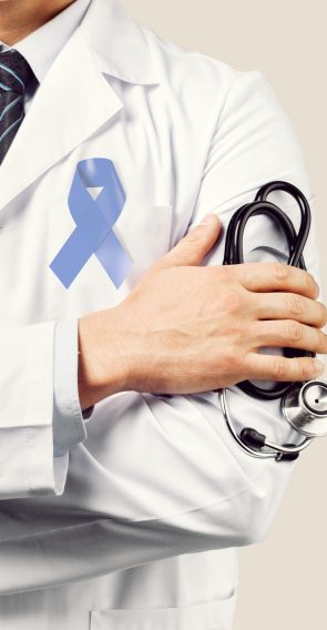 Doctor hands holding Light blue ribbon,  Prostate Cancer Awareness